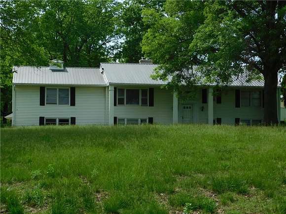 11.5 Acres of Land with Home for Sale in Harrisonville, Missouri