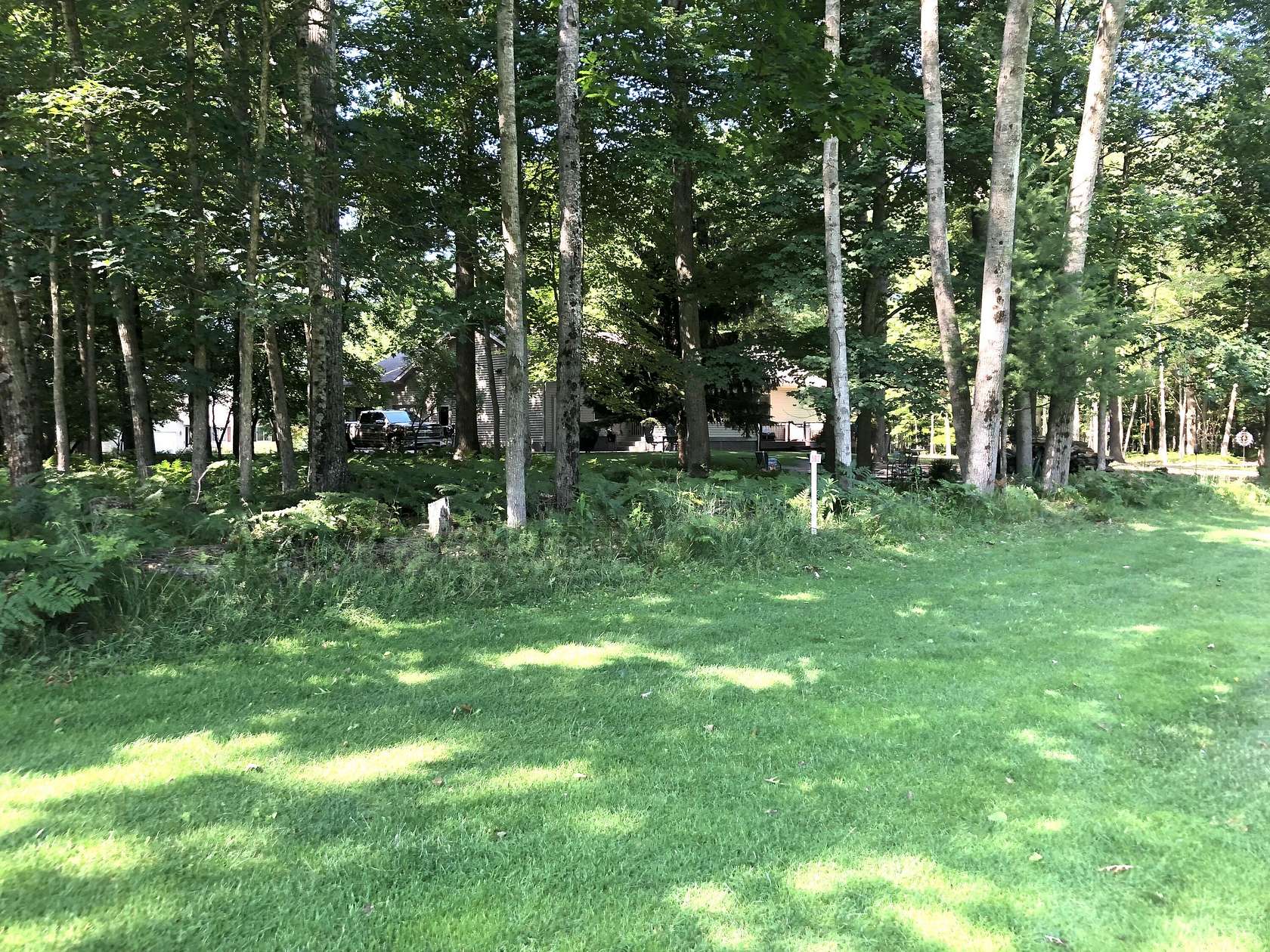 0.46 Acres of Residential Land for Sale in Canadian Lakes, Michigan