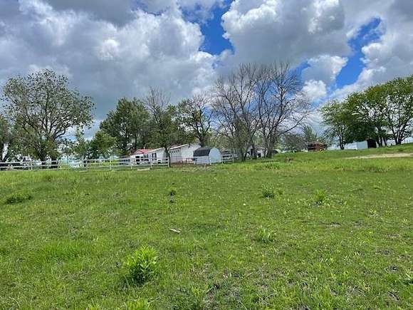 23.1 Acres of Agricultural Land with Home for Sale in Spickard, Missouri