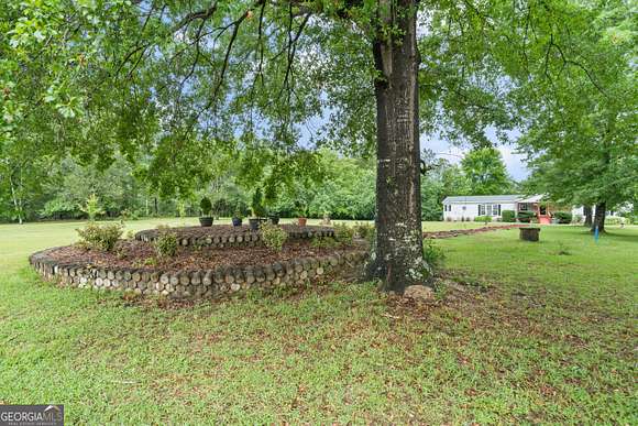 10.4 Acres of Land with Home for Sale in Jeffersonville, Georgia