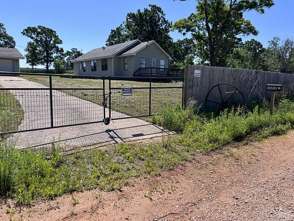 13.9 Acres of Land with Home for Sale in Jay, Oklahoma