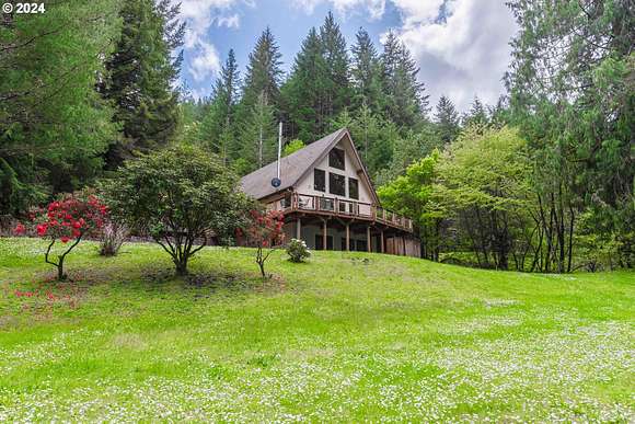 24.8 Acres of Land with Home for Sale in North Bend, Oregon