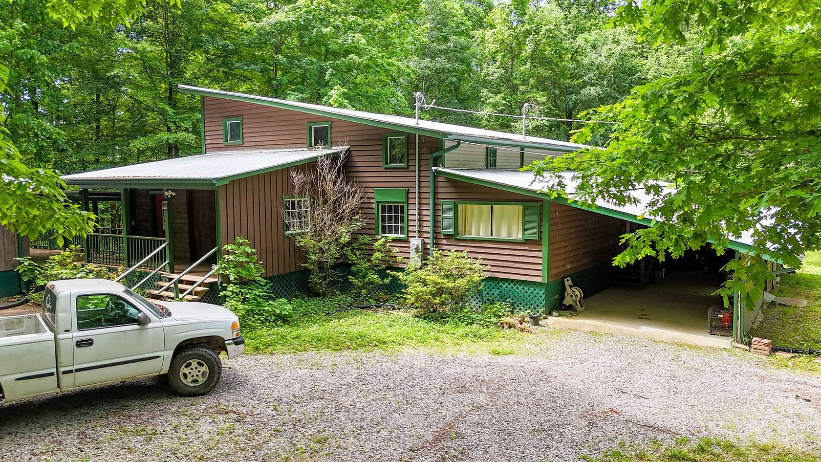 5 Acres of Residential Land with Home for Sale in Summertown, Tennessee