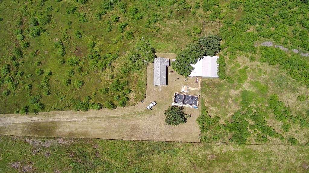 26.08 Acres of Agricultural Land with Home for Sale in Blum, Texas
