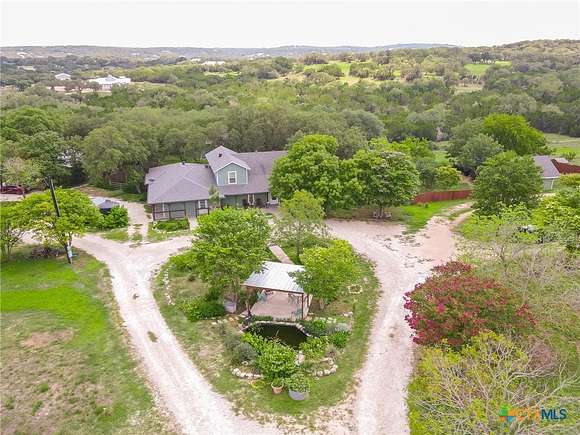 9.765 Acres of Land with Home for Sale in Canyon Lake, Texas