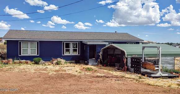 2.5 Acres of Residential Land with Home for Sale in Show Low, Arizona