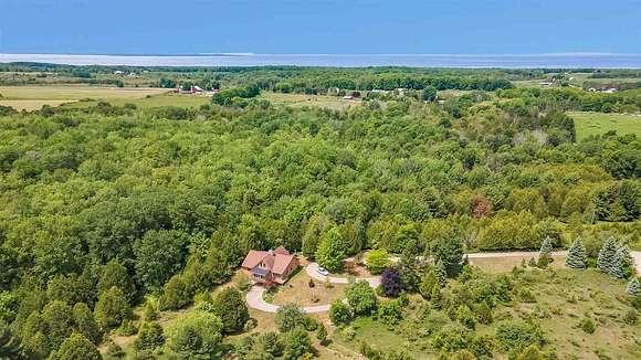 10 Acres of Land with Home for Sale in Charlevoix, Michigan