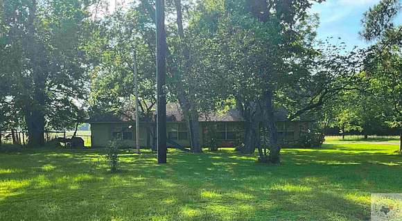 1.1 Acres of Residential Land with Home for Sale in De Kalb, Texas