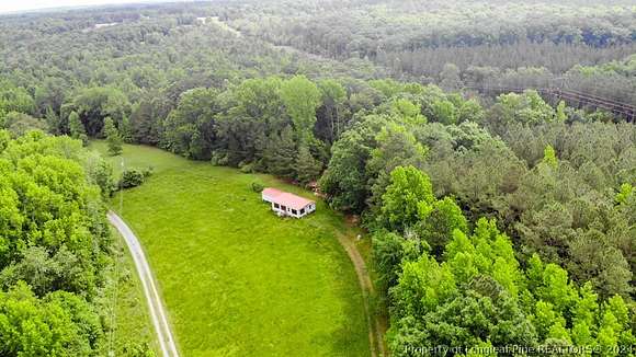 10.09 Acres of Land with Home for Sale in Carthage, North Carolina