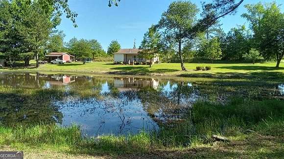13.8 Acres of Recreational Land with Home for Sale in Adrian, Georgia