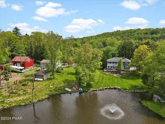 61.1 Acres of Land with Home for Sale in Beach Lake, Pennsylvania