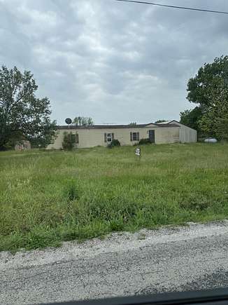 10.4 Acres of Land with Home for Sale in Lockwood, Missouri
