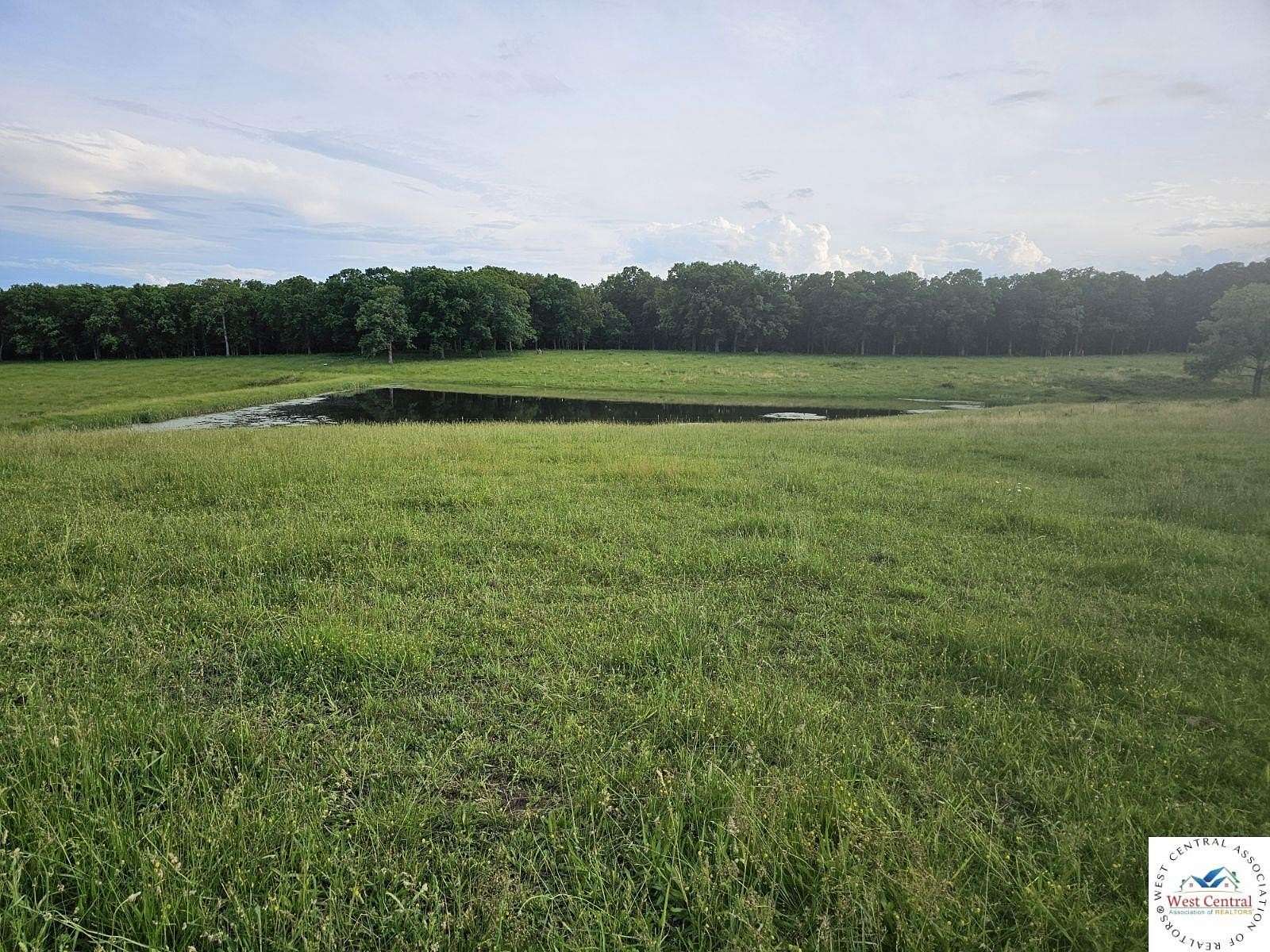 196 Acres of Agricultural Land with Home for Sale in Cole Camp, Missouri