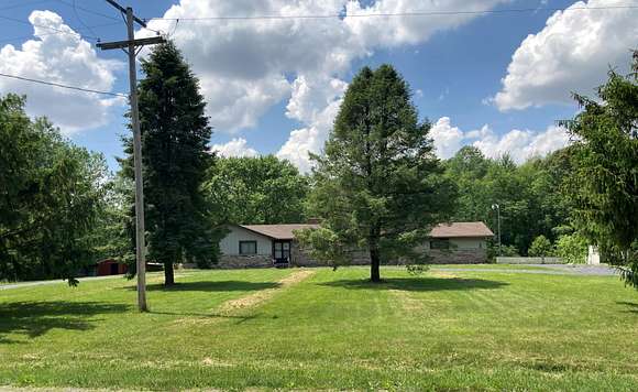 5.1 Acres of Residential Land with Home for Sale in Milan, Michigan