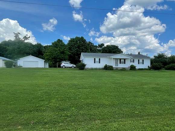 3.2 Acres of Residential Land with Home for Sale in Big Sandy, Tennessee