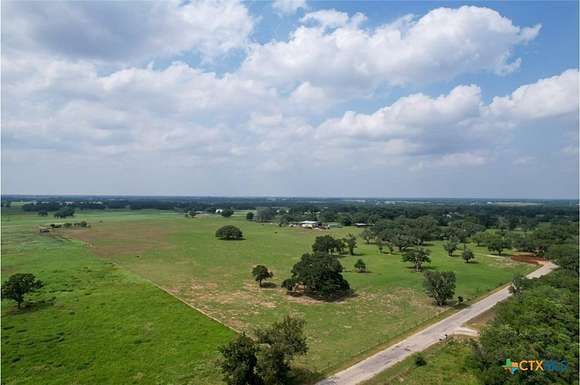 23.384 Acres of Land with Home for Sale in Yoakum, Texas