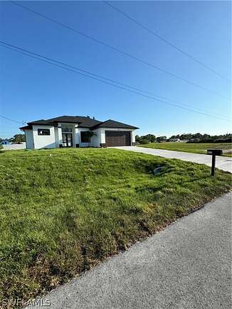 0.25 Acres of Residential Land with Home for Sale in Lehigh Acres, Florida