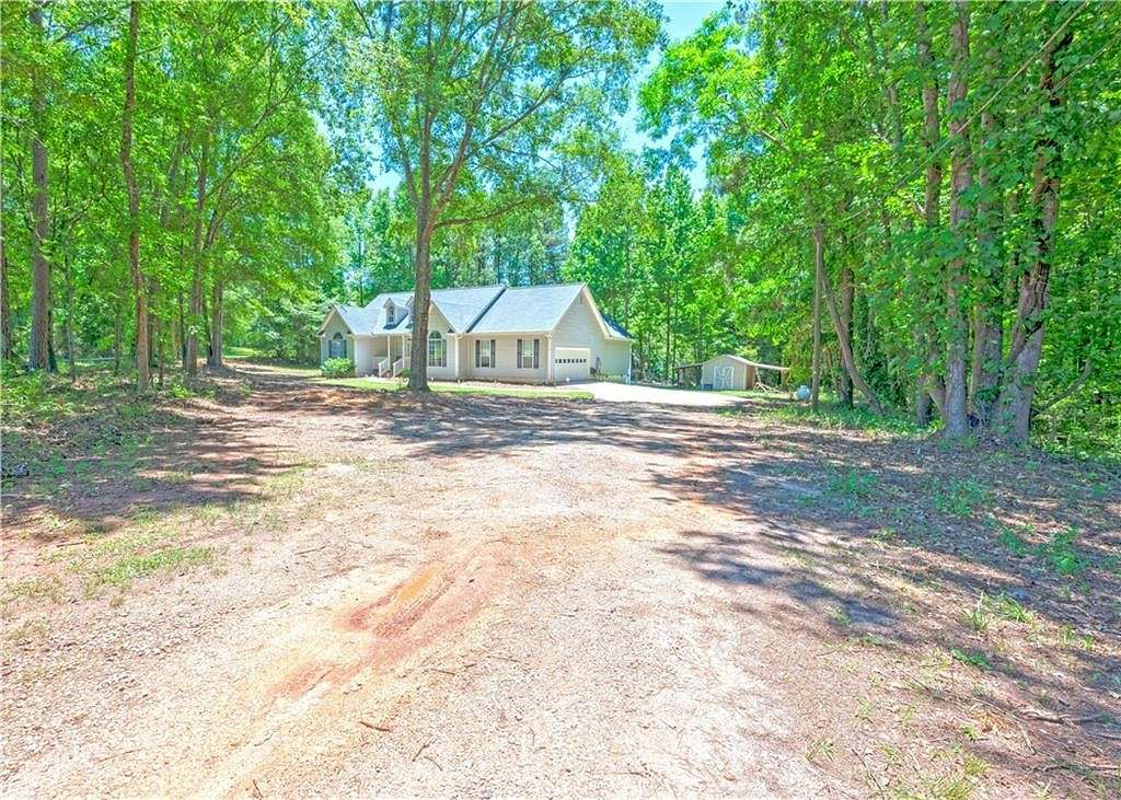 5.8 Acres of Residential Land with Home for Sale in Locust Grove, Georgia