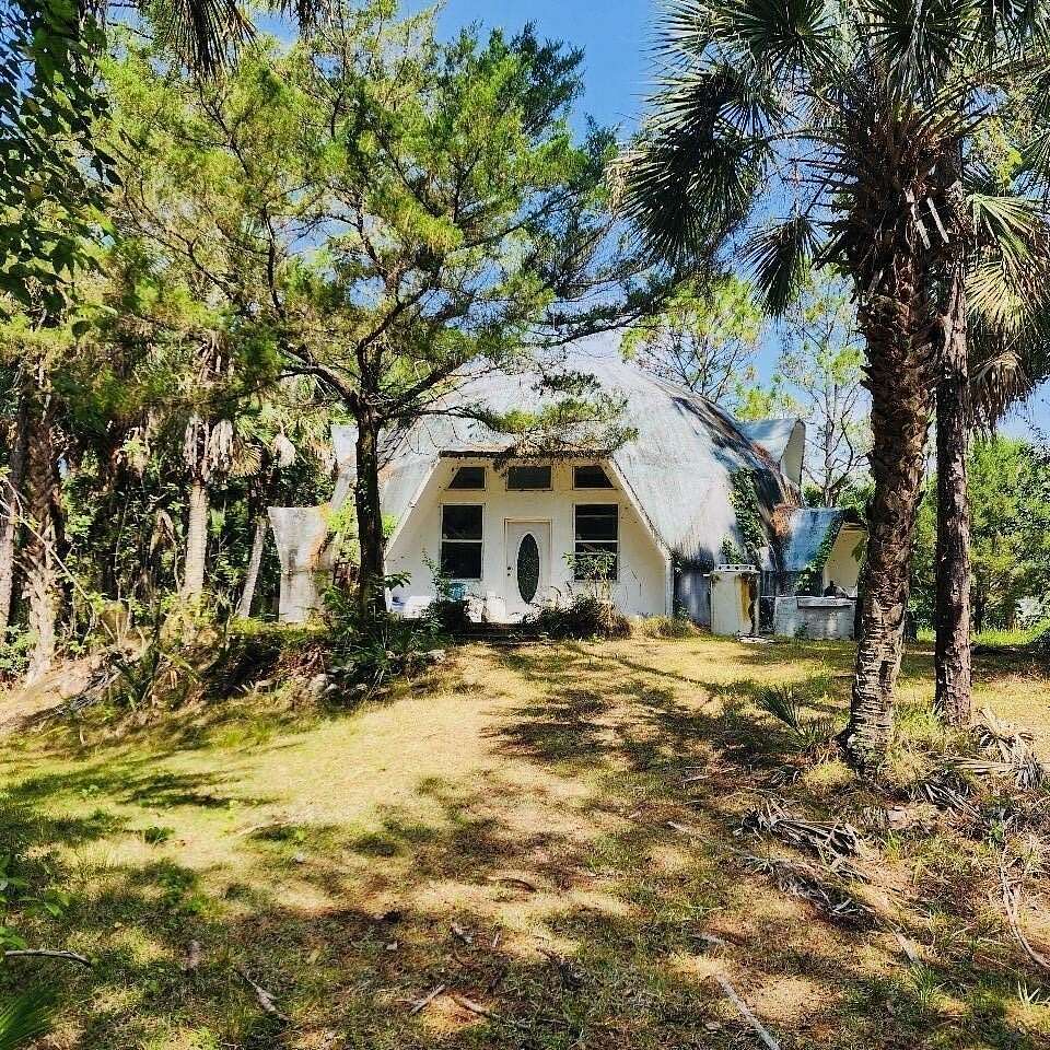 2.3 Acres of Residential Land with Home for Sale in Cocoa, Florida