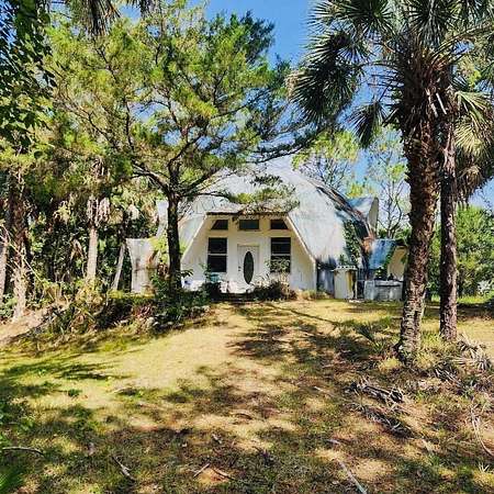 2.3 Acres of Residential Land with Home for Sale in Cocoa, Florida