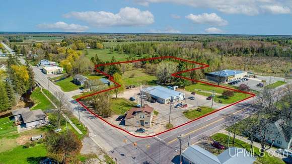 5.3 Acres of Improved Commercial Land for Sale in Perkins, Michigan