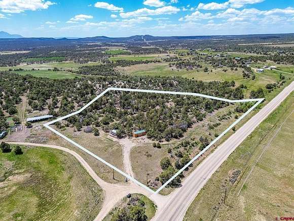 4.9 Acres of Residential Land with Home for Sale in Mancos, Colorado
