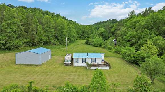 115 Acres of Land with Home for Sale in Olive Hill, Kentucky
