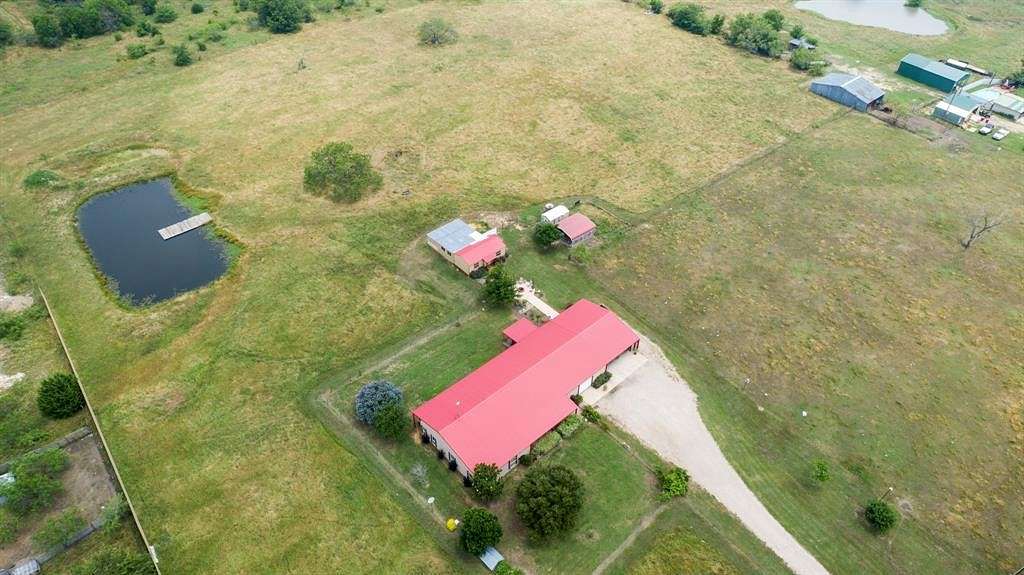 8.4 Acres of Residential Land with Home for Sale in Scurry, Texas