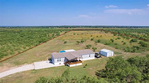 18.1 Acres of Land with Home for Sale in Brookesmith, Texas