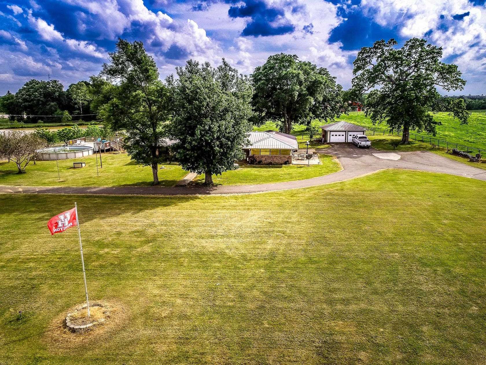 212 Acres of Land with Home for Sale in Carthage, Texas