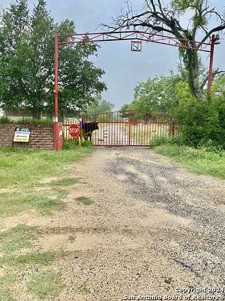 5 Acres of Residential Land with Home for Sale in Poteet, Texas