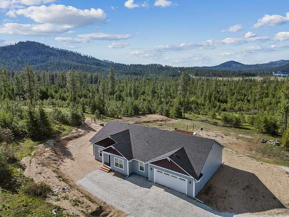 20 Acres of Land with Home for Sale in Loon Lake, Washington