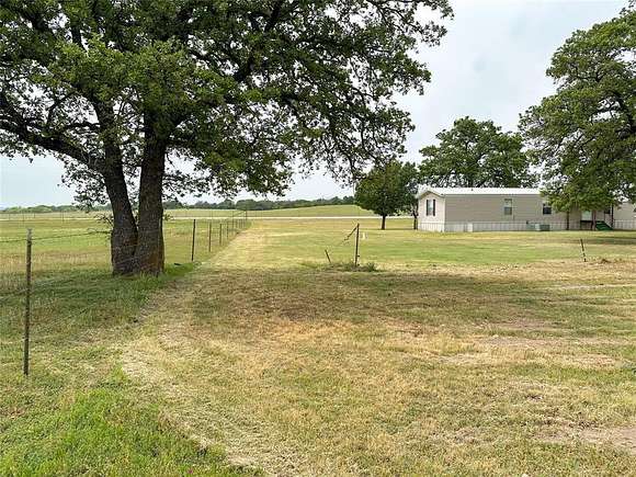 10 Acres of Residential Land with Home for Sale in Cisco, Texas