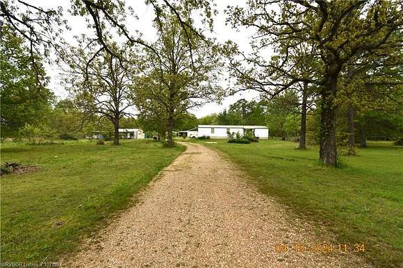 7.8 Acres of Residential Land with Home for Sale in Sallisaw, Oklahoma