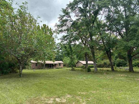 5.73 Acres of Residential Land with Home for Sale in Jay, Florida