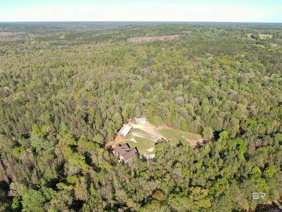 140 Acres of Land with Home for Sale in Peterman, Alabama