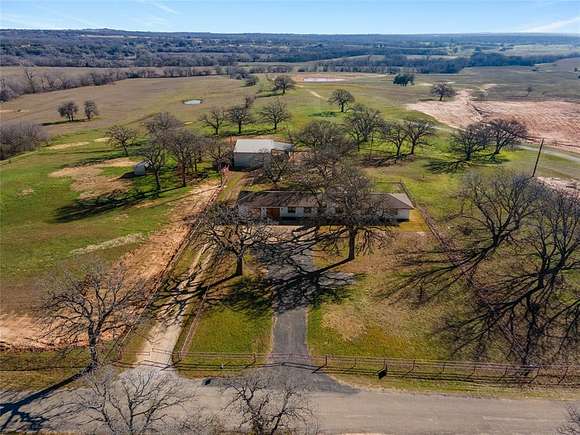5.5 Acres of Residential Land with Home for Sale in Poolville, Texas