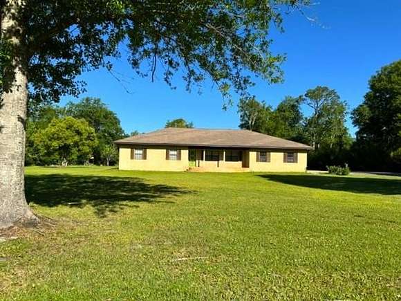 0.95 Acres of Residential Land with Home for Sale in Wewahitchka, Florida