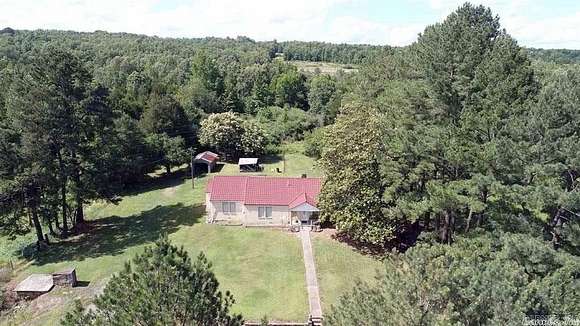 65 Acres of Land with Home for Sale in Quitman, Arkansas