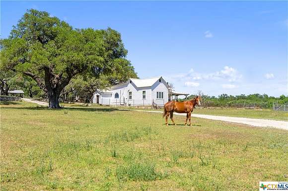 92.1 Acres of Agricultural Land with Home for Sale in Blanco, Texas