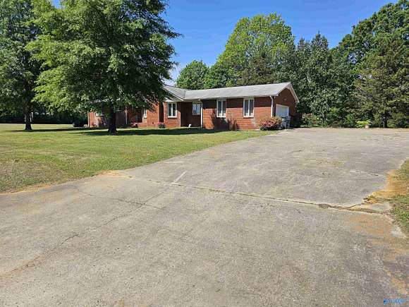 3.2 Acres of Residential Land with Home for Sale in Laceys Spring, Alabama