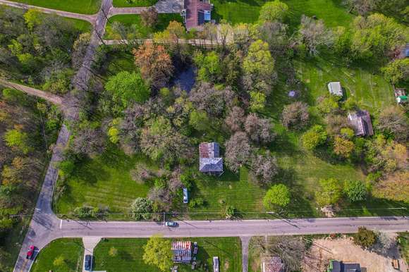 3.5 Acres of Residential Land with Home for Auction in Ostrander, Ohio