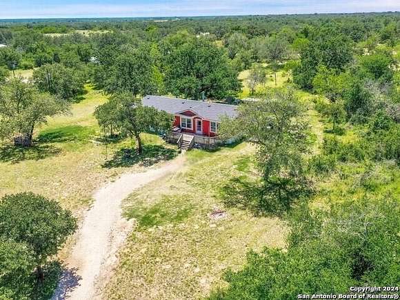 4.5 Acres of Residential Land with Home for Sale in Poteet, Texas