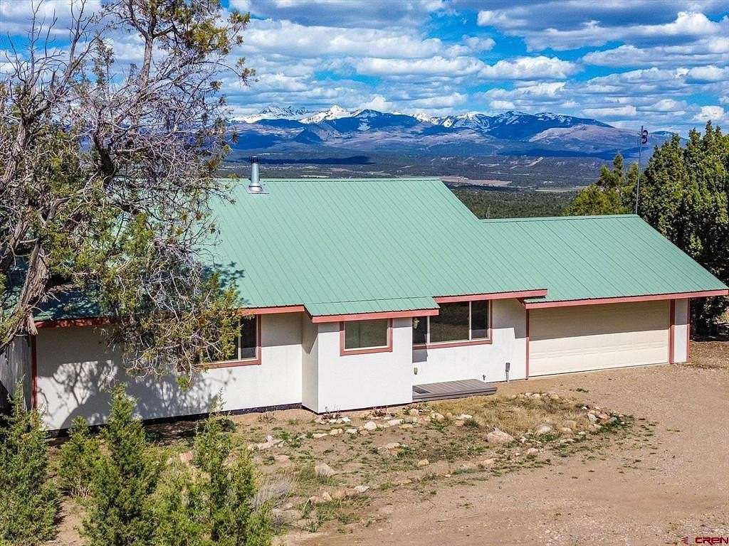 7 Acres of Residential Land with Home for Sale in Mancos, Colorado