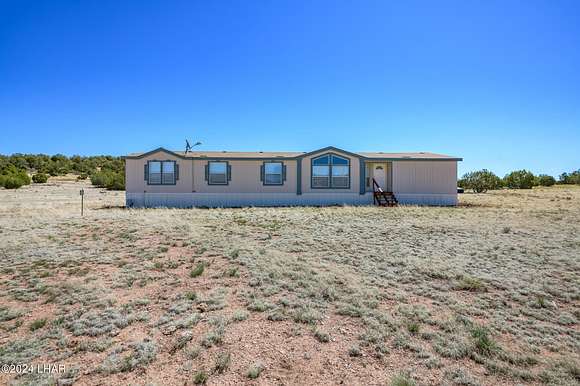 5.4 Acres of Residential Land with Home for Sale in Seligman, Arizona