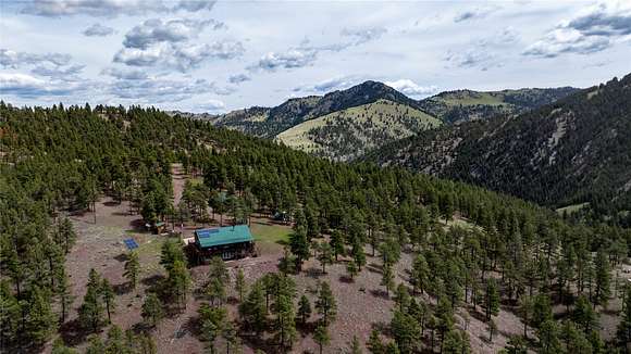 79.1 Acres of Recreational Land with Home for Sale in Wolf Creek, Montana