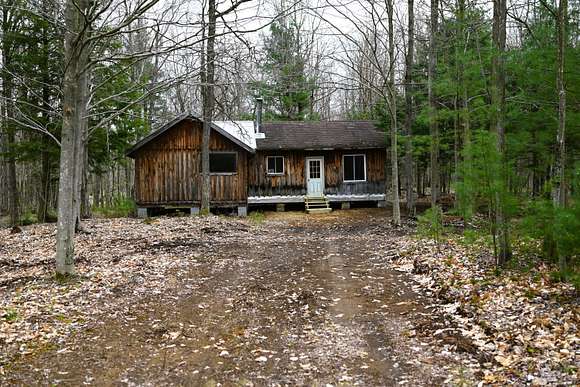 144 Acres of Recreational Land with Home for Sale in Constable, New York