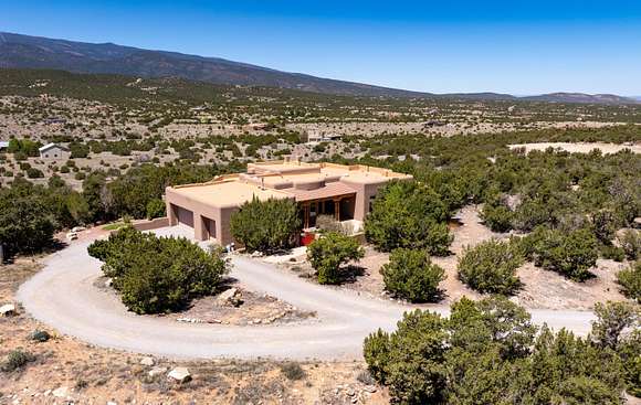 10 Acres of Residential Land with Home for Sale in Sandia Park, New Mexico