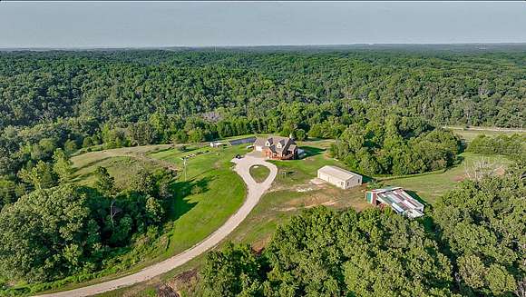 51.42 Acres of Agricultural Land with Home for Sale in Highlandville, Missouri