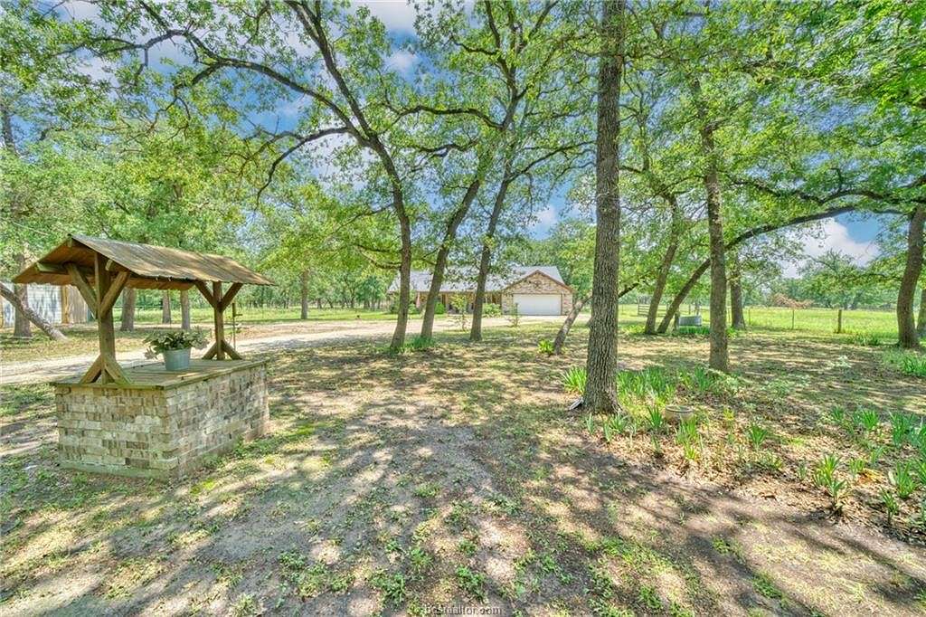 10 Acres of Residential Land with Home for Sale in Madisonville, Texas